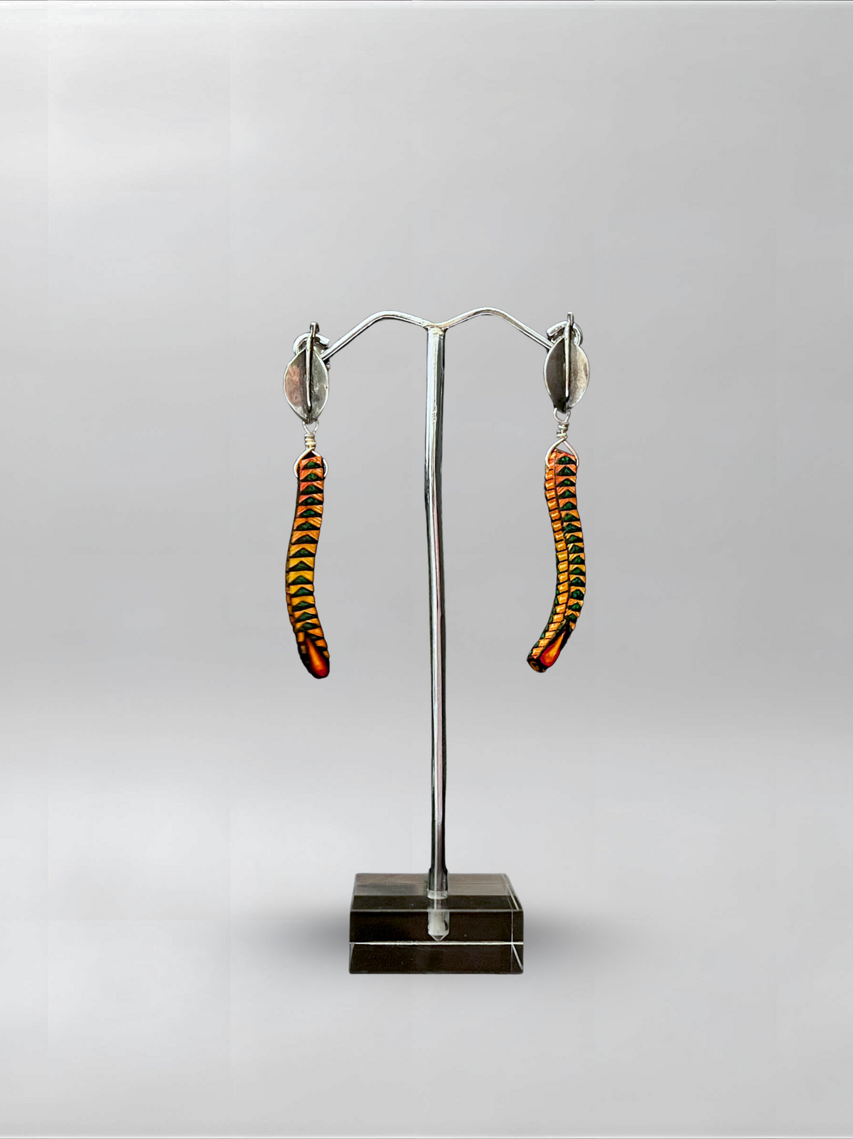 Amber Spine — one-of-one hand-carved wood and sterling silver earrings