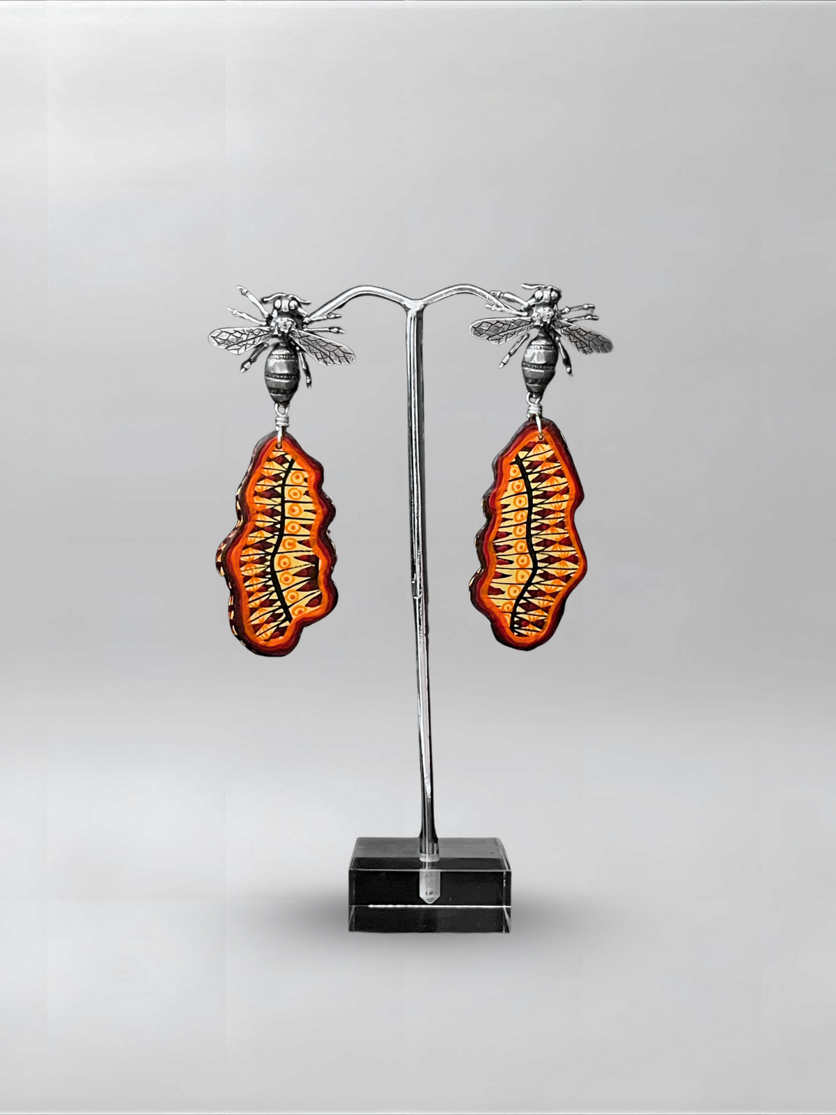 Orange Static — one-of-one hand-carved wood and sterling silver earrings